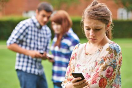 students looking at mobile phone